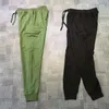 pantaloni con tasche laterali