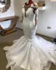 2020 Hot Luxury Mermaid Bröllopsklänningar Juvel Neckus Illusion Lace Appliques Crystal Beaded Långärmade Court Train African Bridal Gowns