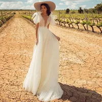 Sexy V-hals Beach Wedding Dress Backless A Line Lange Dot Lace Bridal Fabriek van de Toga Custom Made Gowns