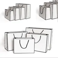 Blanco presente Tarjeta bolsas de papel kraft de embalaje en bolsas de tela de almacenamiento de moda bolso de compras del espesamiento Publicidad personalizada 1 86GR c2