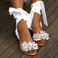 Venta caliente-Classic Diseñador de lujo Comemore New Sandals Mujer Verano Femenino Femenino Moda Encaje Plana Sandalia Antidea Linda Beads Flower Casual Band