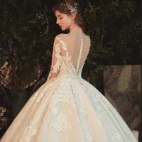 Beading Pearls Appliques Lace Illusion Princess Ball Gown Bröllopsklänning med långärmad Vestido de Noiva Princesa Galajurk
