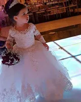 結婚式の長袖の花の女の子のドレスクルーネックレースアップリケの服着服長い床チュールビーズページェント党ドレス