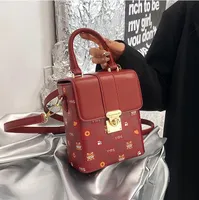 Wholesaleladies leathers shoulder bags This years popular cartoon printed handbag street trend gold buckle small square bag vertical shaped fashion backpack