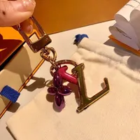 Designer Brief Four-Blatt-Klee-Schlüsselanhänger Hohe Qualität 5AAAAA-Zubehör Mode Keychain für Männer Frauen Anhänger mit Box