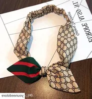Designer branded luxus elegante bogenknoten elastische kreative spleiß berühmte stirnband seide mode frauen haar bands schmuck