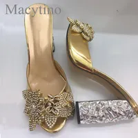 النعال Macytino أحذية جلدية المرأة كريستال زهرة مزينة عالية الكعب الشرائح اللباس الرسمي البغال الذهب المعدني