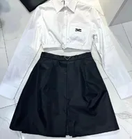 22SS dames rok korte shirt mode met nylon omgekeerde driehoek stijl dame sexy jurk hoge kwaliteit zwarte maat S-L