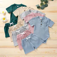 Baby Boy девушка одежда одежда одежда набор карманный ползунки шорты 2 шт. С коротким рукавом комбинезон костюма носить лето сплошной цветной наряд пижамы 3252 Q2