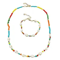 Chaînes en perles Collier et bracelet de coquille adaptés aux dames Filles Colliers de graines de couleur à la main Bohême
