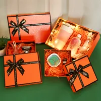オレンジ色のギフトラップの化粧品の口紅包装箱、黒の弓結び目1200-1400G段ボールのお祝いパーティーの靴のパッケージペーパーボックスサプライズプレゼントPapel de Regalo