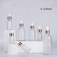 Wholesale garrafas de conta-gotas de vidro sérico claro 5ml 10ml 15ml 20ml 30ml 50ml 100ml com LID Rose Gold para óleos essenciais