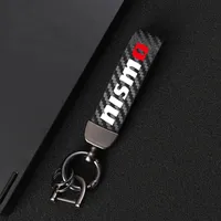 Nyckelringar Karbonfiber Läder Keychain 360 graders roterande hästsko Key Ringar för Nissan Nismo Tiida Teana Skyline X-Trail Qashqai Car