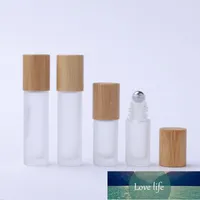 12 unids 5 ml 10 ml Tapa de bambú natural / gorra de óleo transparente de vidrio transparente espeso en botella de rodillo de metal para perfume aromaterapia