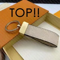 TOPP. M00286 Maxi Dragonne Key Holder Bag Delar Tillbehör Designer Kvinnor Saffron Empreinte Läder Ring KeyRing Keyhållare Kedja Namn Tag Bell Lock Cochette