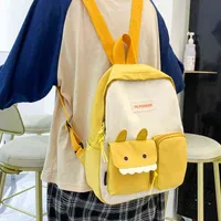 2021 NUEVO Japón Dibujos animados Little Monsters Mochila Kawaii Girls Middle School Color Pure Color Bag Simple Multi-Pocket Nylon Bag Y1105