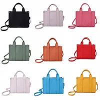 Luxo The Tote Bag Designer Women Mini Grande Canvas Couro Crossbody Bolsas de ombro com cinta Bolsa de bolsas de rosa preto PVC