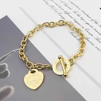 Hot selling personalized stainls ot buckle love bracelet female titanium steel 18K heart-shaped pendant couple jewelry