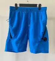 Nuevos pantalones al aire libre de jóvenes de verano Sports Nylon Couts Shorts Flowing Men's Beach 5 puntos Pantalones