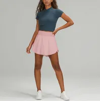 Nuevos atuendos de yoga tenis tenis raíz de la cadera de la cadera de malla faldas cortas para mujeres faldas de fitness de doble capa femenina