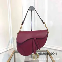 Factory Outlet Luxury Bags and Handbags Women's 2022 leather half round one shoulder cross carry saddle