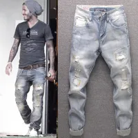 2022 Европейский и американский ретро -джинсы мужской сшивающий нищий старый патч с прямыми длинными брюками.