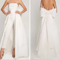 Fashion Designers Wedding Dress Ivory Satin Jumpsuit With Detachable Skirt Back Bow Bride Reception Gowns Sexy Strapless Backless Bridal Pants Suits