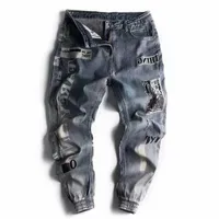 Heren jeans ontwerper voor mannen brief print mannelijke harembroeken baggy noodless man vracht enkelbandige hiphop gescheurde jeansmen's