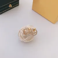 2022 Pendientes de perlas de diseñador para mujeres Pendientes de diseñador Luxurys Diseñadores de joyas aros Fendos con boda de diamante D2206113Z