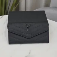 Lädermodehand som håller plånböcker Lyxiga plånbok för kvinnors plånböcker och innehavare Lyxdesigner