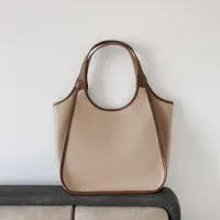 Alta calidad 2022 Nuevo Douyin Handheld Cuero Vintage Bolsa de mujer Smiley Face Bag Bag Bolsa de cubo