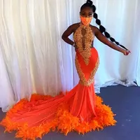 Pomarańczowe pióra Syrenki Prom Dresses Dla Czarnych Dziewczyn Halter Koronki Aplikacje Backless Evening Birthday Party Dress Długie Afryki VOG343