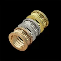 Klassisk designer Spring Gear Diamond Ring rostfritt stål 18K guldpläterade parringar mode bröllopsringar för män och kvinnor