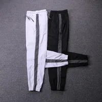 Odblaskowe spodnie dresowe Mężczyźni Ubrania 2021 Para Styl Hip Hop Pant Streetwear Track Spodnie Elastyczne Talii Moda Joggers Spodnie Kobiety