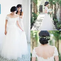 Modest Sheer Neck Jewel Lace Tulle Bröllopsklänningar med kortärmad applique Back Hollow Romantic Boho Bridal Gowns Formell Bride Dress