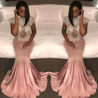 2018 Dusty Pink African Prom Dresses Mermaid High Collar See Through Cap Sleeves Apliques de encaje con cuentas Vestido de fiesta brillante Vestidos de noche Wear