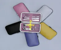 50 ensembles / lot Expédition rapide 7 pcs Portable Manucure Set Nail Care Clippers Ciseaux Voyage Krooming Kits couleur aléatoire