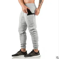 Más nuevos para hombre Sweetpants Man Gimnasios Fitness Culturismo Entrenamiento Pantalones Pantalones de lápiz de algodón masculino Masculino Casual Moda delgado Pantalones largos