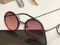 Art und Weise runde Sonnenbrille-Ketten-Halskette Sonnenbrille gafas de sol Frauen arbeiten randlos Sonnenbrillen Gläser neu mit Box