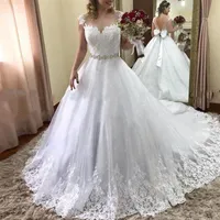 Lyx A-Line Pärlor Bälte Bröllopsklänningar Sheer Neck Lace Appliques Sequined Wedding Ball Gown Sweep Train Tulle Bridal Dress With Bow