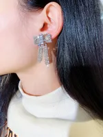 concepteur de luxe de la mode style de gros- de super diamants étincelants Zircon boucles d'oreilles mignonnes belle arc pour les filles femme