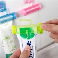 Plastic Toothpaste Rolling Tube Squeezer Holders Useful Toothpastes Easy Dispenser Bathroom Holder Sucker Hook Facial Cleanser DBC BH3551