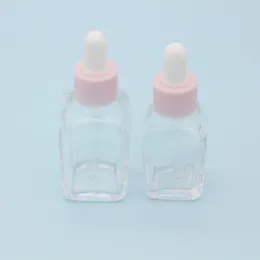 Оптовая 20 мл эфирного масла квадратная бутылка капельницы 30 мл прозрачные стеклянные сывороточные бутылки с розовой крышкой для косметики