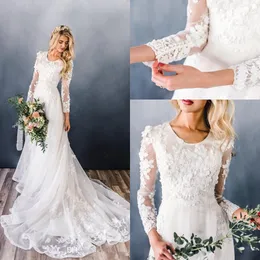 Nuovi abiti da sposa modesti a-line in pizzo elegante con maniche lunghe scollo rotondo Applicazioni in pizzo floreale 3D Abiti da sposa con cappella in rilievo