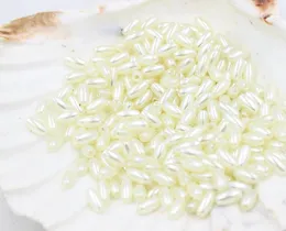 1000pcs Elfenbein ABS-nachgemachte Perlen-Reis-Korn-DIY Schmuck Accessoires Europäischer Spacer-Loch-Korne für Schmuckherstellung 4x8mm