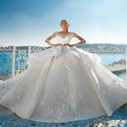 Lyxbröllopsklänningar Tiered Feather Crystal Sequins Appliqued Lace Sexig Sheer Långärmad Bröllopklänning Anpassad Made Sweep Train Bridal Dress