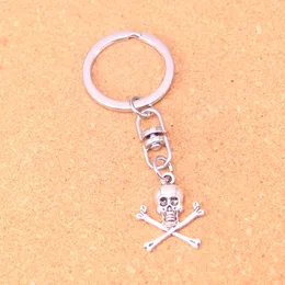Fashion Keychain 24 * 19mm Skalle Skelett benhängen DIY smycken bil nyckelkedja ringhållare souvenir för gåva