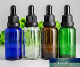 Clear Brown Blue Green Essential Oil Glass Dropper Bottles 1OZ E-Liquid Glass Vial with Black Tamper Lids Hot Sale