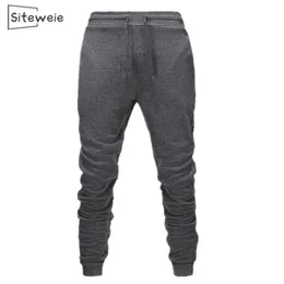 SITEWEIE Pantaloni sportivi da uomo in cotone casual Pantaloni da jogging Pantaloni Body Builder Pantaloni Pantaloni Moda Hot Fitness Pantaloni da palestra L251 201125