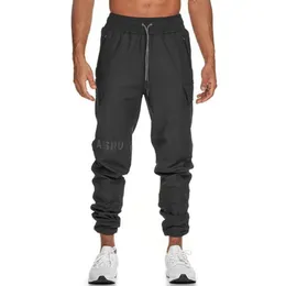 Mens outono casual algodão de algodão com calças de bolso homem ginásios fitness musculação muscular calças magras masculino bocador treino pa 201106